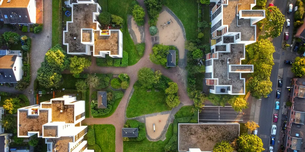 Aerial view of a modern residential community with landscaped courtyards and walkways